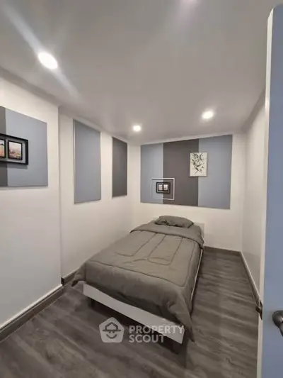 Cozy minimalist bedroom with modern decor and soft lighting