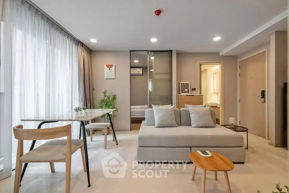 Modern open-plan living room with stylish furniture and natural light