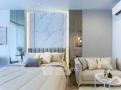 Luxurious bedroom with elegant decor and cozy seating area, perfect for relaxation and comfort.