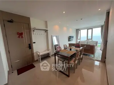 Spacious living room with dining area and stunning view in modern apartment