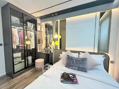 Luxurious bedroom with modern design, featuring a walk-in closet and stylish decor, perfect for urban living.