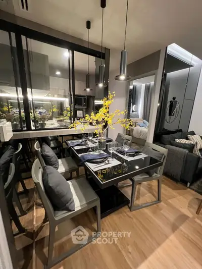 Modern dining area with sleek furniture and stylish decor in a contemporary apartment.