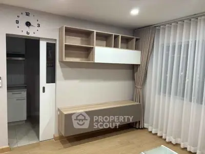 Modern living room with wall-mounted shelves and elegant curtains