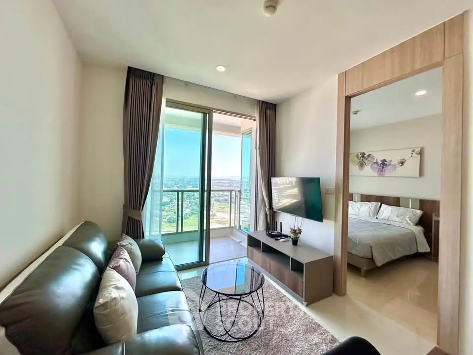 Modern living room with balcony and stunning view in high-rise apartment