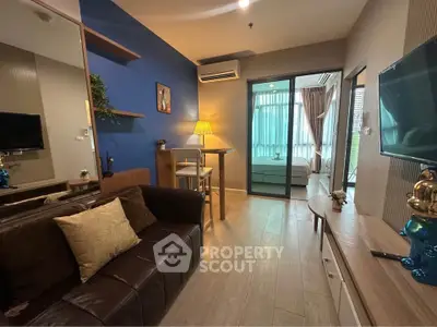 Modern living room with stylish decor and open view to bedroom