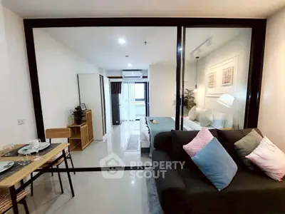 Modern open-plan living room with stylish decor and dining area