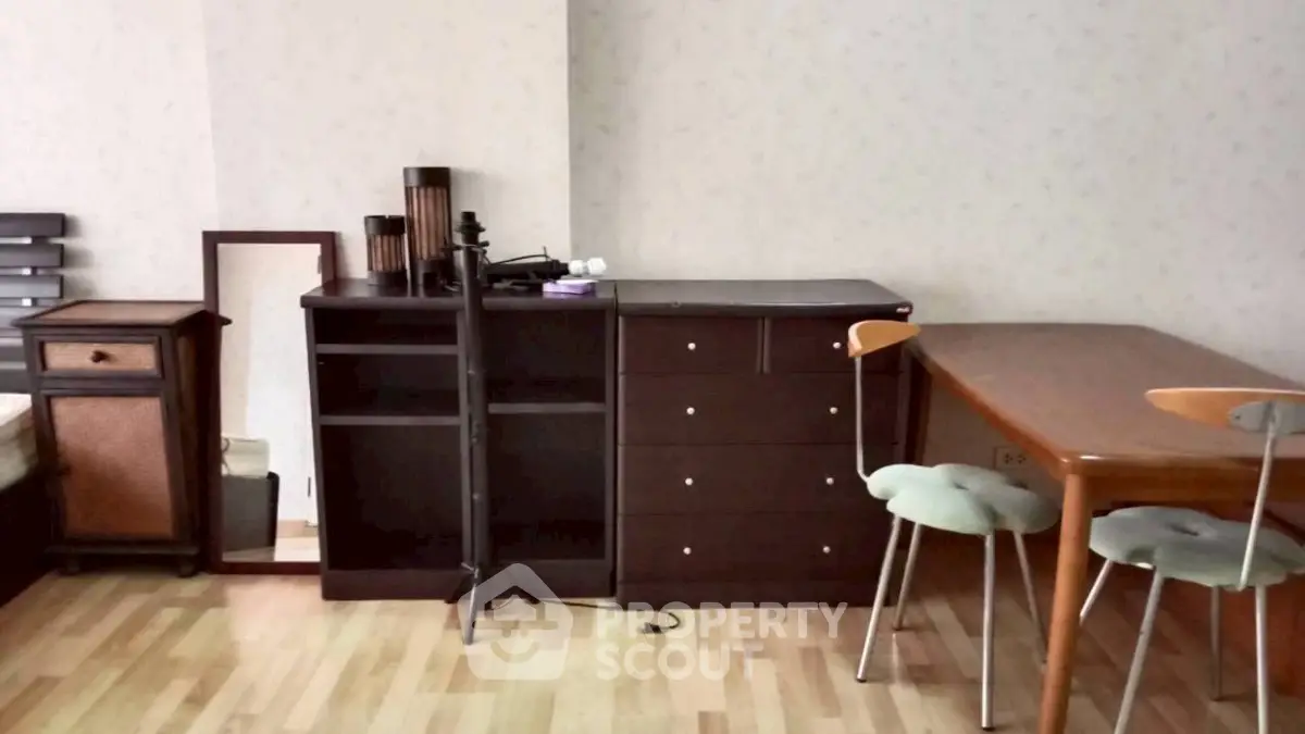 Cozy interior with wooden furniture and modern decor in a stylish living space.