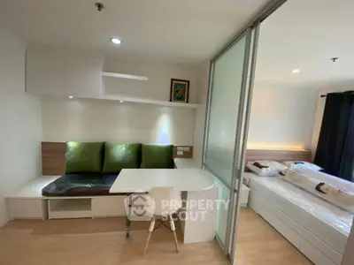 Modern studio apartment with sliding glass partition and stylish decor
