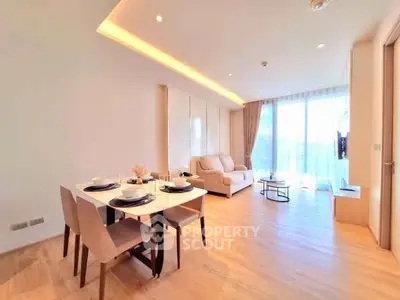 Spacious modern living room with dining area and natural light