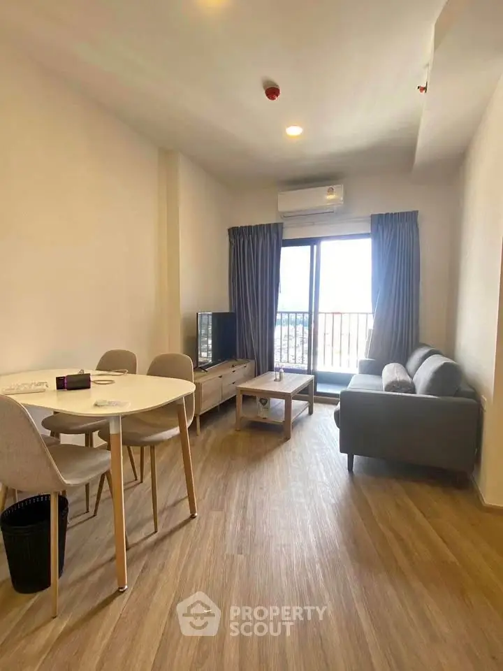 Modern living room with balcony view and stylish furniture