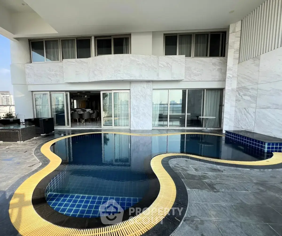 Luxurious modern apartment with private pool and stunning city views.