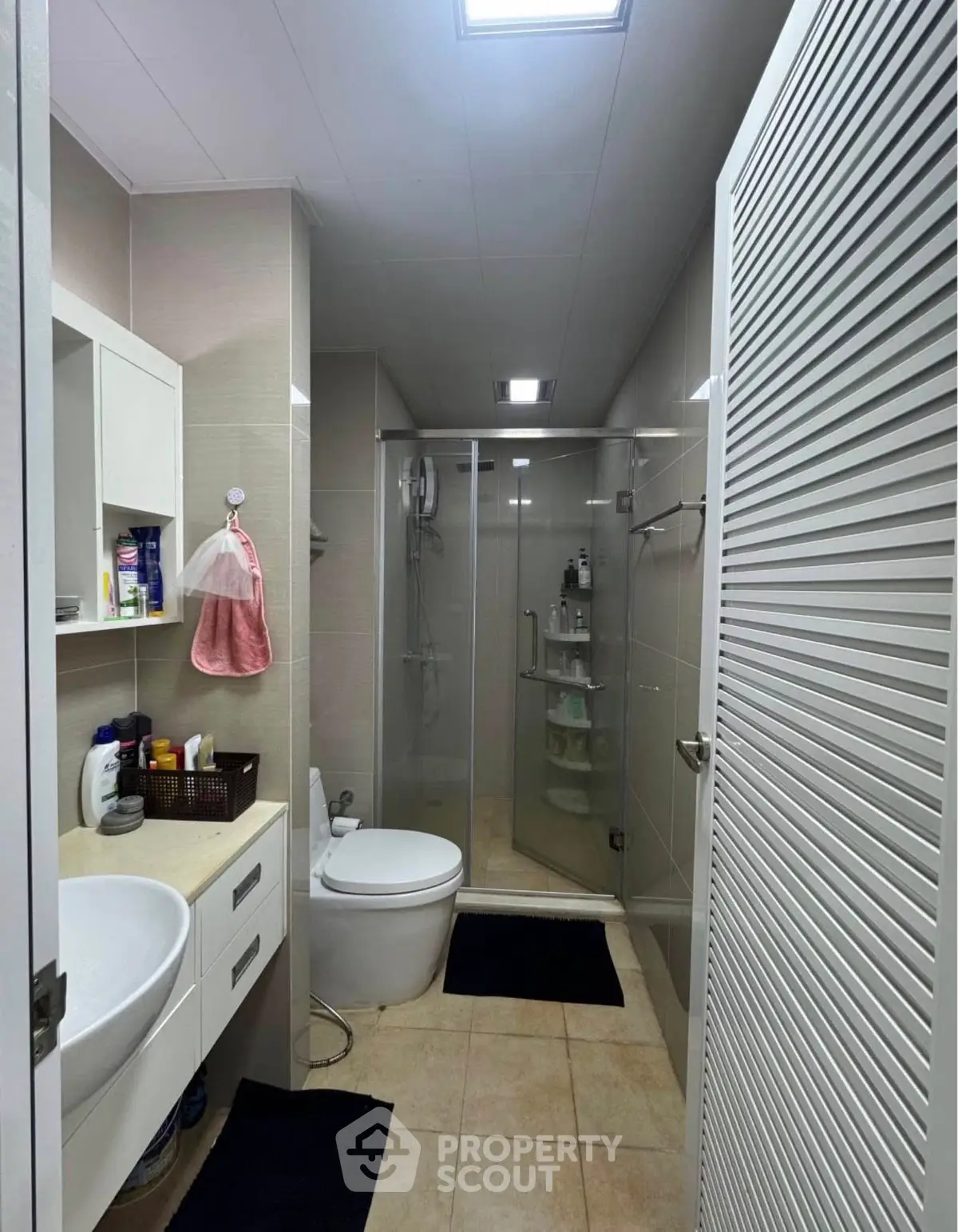 Modern bathroom with glass shower and sleek fixtures