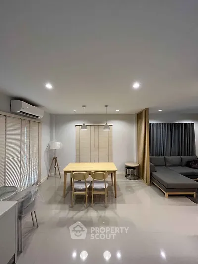 Modern living room with sleek furniture and ambient lighting