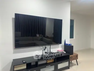 Modern living room with sleek TV setup and stylish furniture