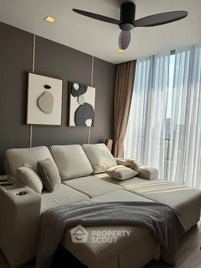 Modern living room with stylish decor and large window offering city view