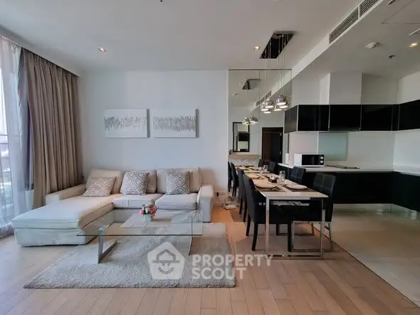 Luxurious open-plan living room with modern kitchen and elegant dining area