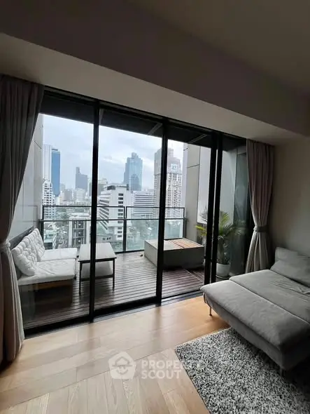 Modern living room with stunning city view and spacious balcony