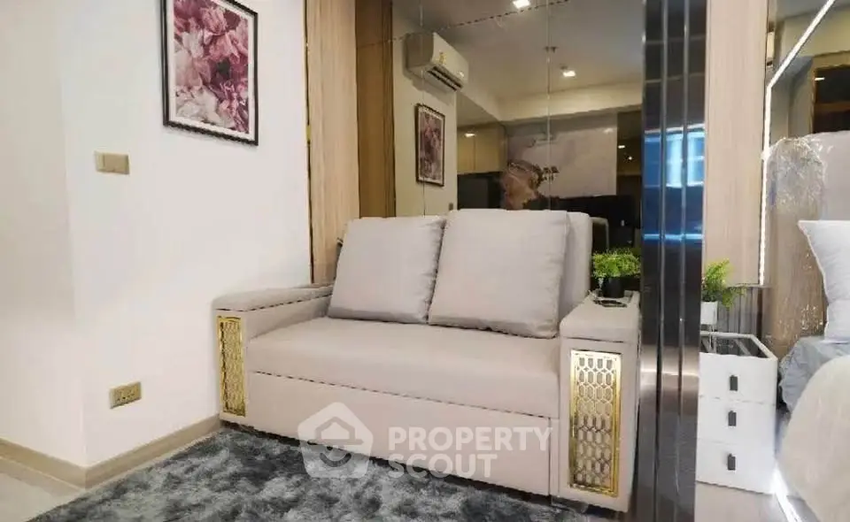 Modern living room with stylish sofa and elegant decor in a cozy apartment setting.