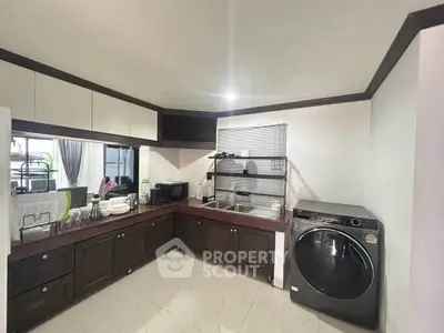 Modern kitchen with sleek appliances and ample storage space