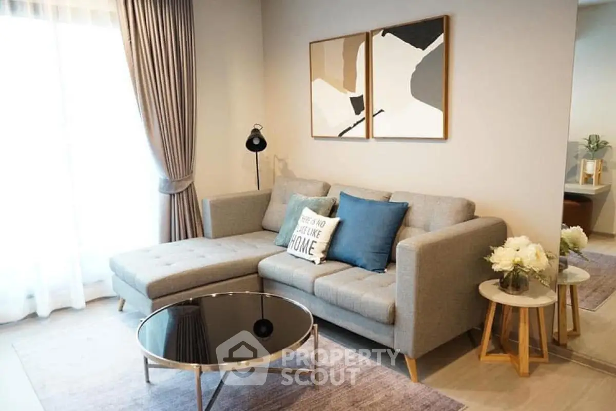 Stylish living room with modern decor and cozy seating area.