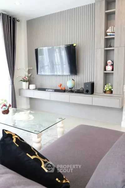 Modern living room with sleek TV setup and stylish decor