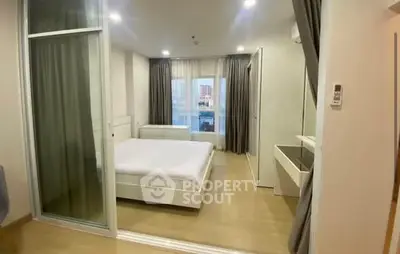 Modern bedroom with large windows and sleek furnishings