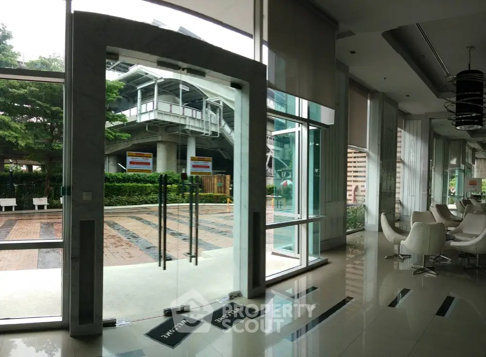 Modern building entrance with glass doors and stylish interior design