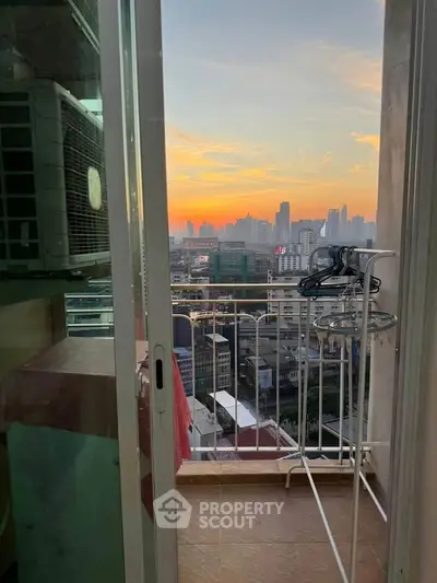 Stunning cityscape view from a high-rise balcony at sunset, perfect for urban living enthusiasts.
