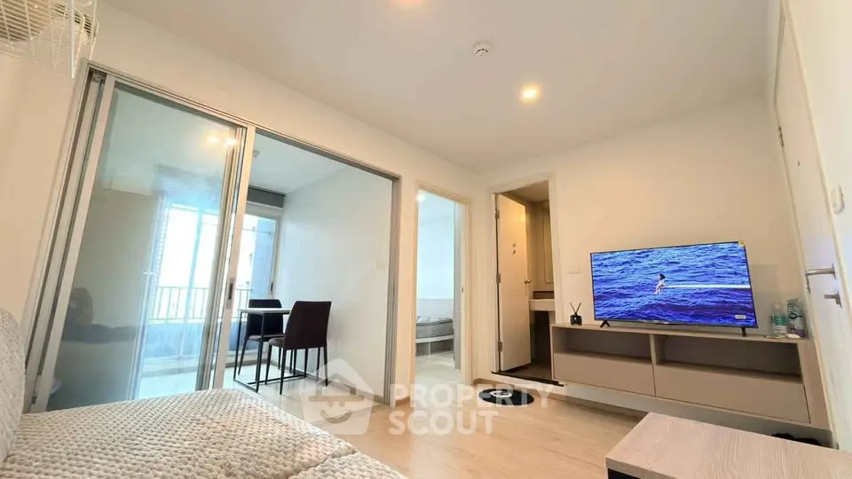 Modern living room with sliding glass doors and cozy seating area