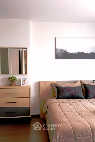 Modern bedroom with stylish decor and cozy bedding