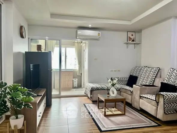 Spacious living room with modern decor and natural light