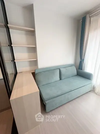 Modern living room with sleek sofa and built-in shelving, perfect for urban living.