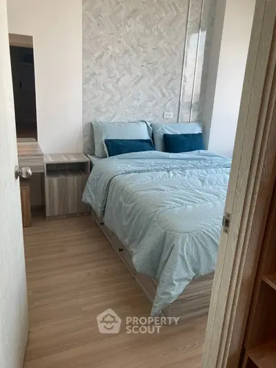 Cozy bedroom with modern decor and wooden flooring