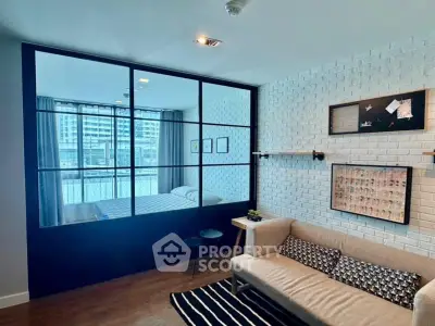 Modern living room with glass partition and stylish decor in urban apartment