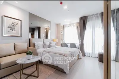 Modern bedroom with cozy seating area and elegant decor