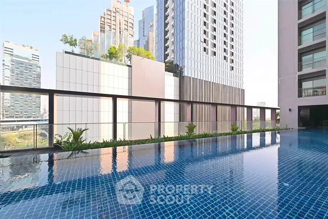 Luxurious high-rise building with stunning rooftop pool and cityscape views.