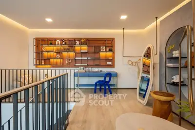 Stylish modern living room with unique decor and open layout, featuring elegant shelving and contemporary furniture.