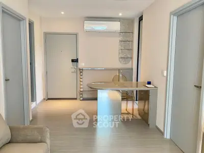 Modern apartment interior with sleek design and air conditioning unit.
