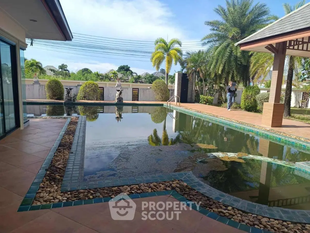 Luxurious villa with private pool and lush garden, perfect for relaxation and entertaining.