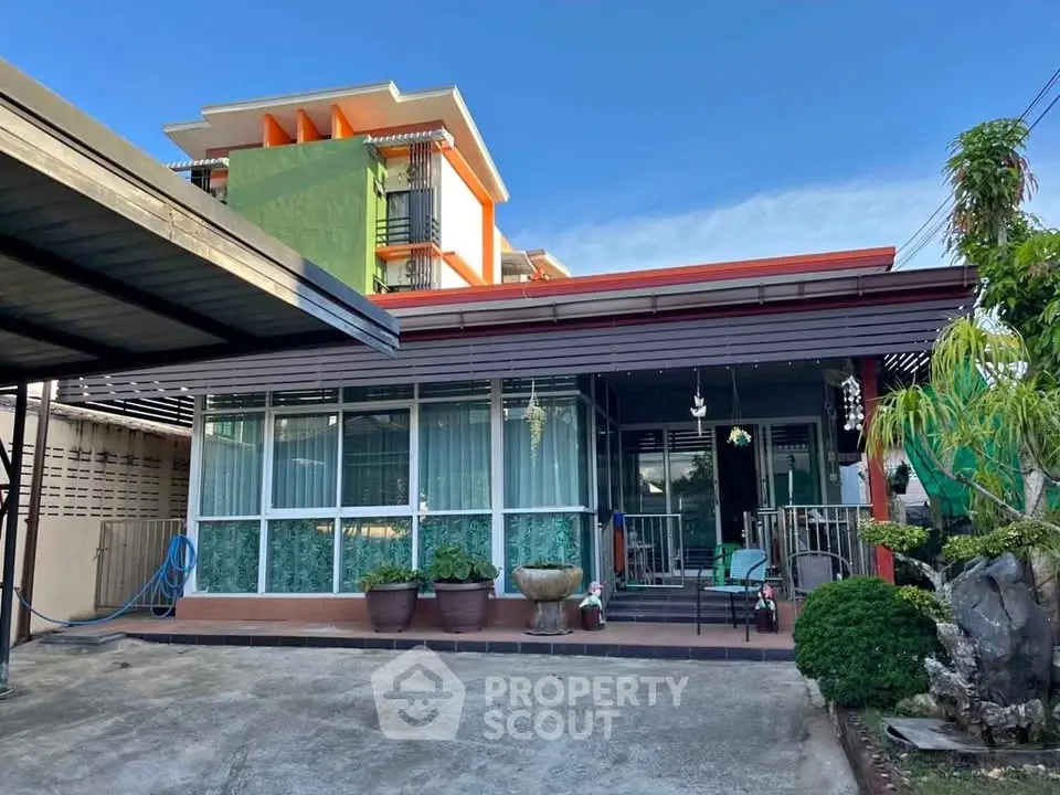 Charming single-story home with modern facade and lush garden in a serene neighborhood.