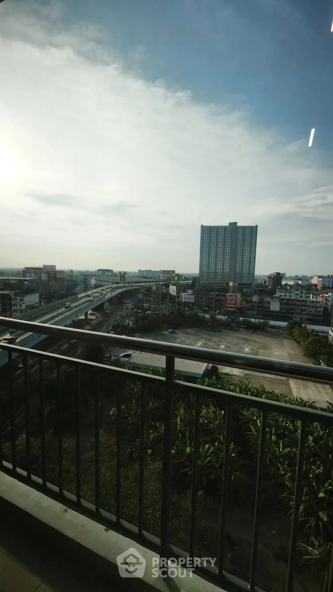 Stunning cityscape view from a high-rise balcony, perfect for urban living.