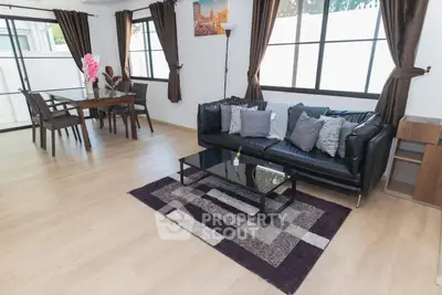 Spacious modern living room with stylish decor and natural light