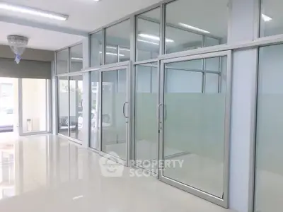 Modern office space with glass partitions and sleek design