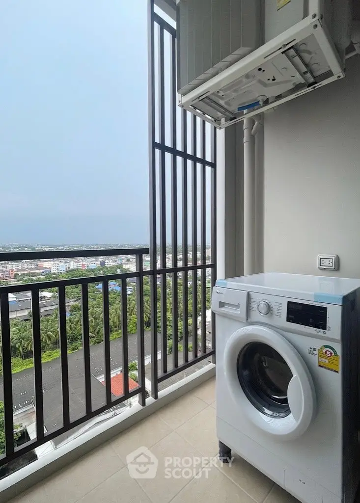 Modern balcony with washing machine and scenic city view, perfect for urban living convenience.