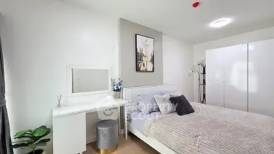 Modern bedroom with stylish decor and ample natural light