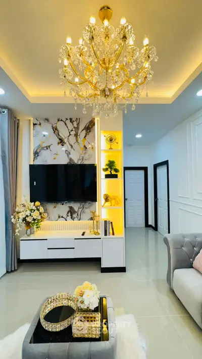 Luxurious living room with elegant chandelier and modern decor