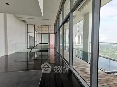 Luxurious modern apartment with floor-to-ceiling windows and stunning panoramic views.