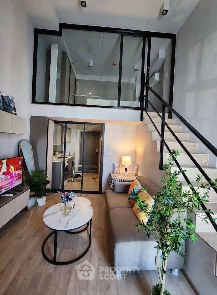 Modern duplex living room with stylish decor and mezzanine level