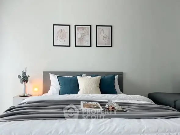 Modern bedroom with stylish decor and cozy bedding