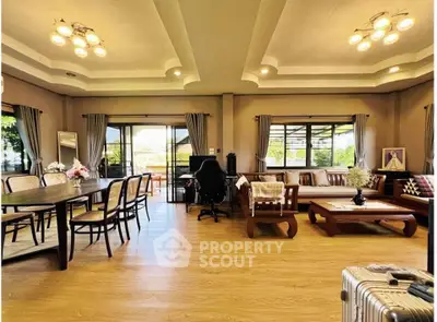 Spacious living room with elegant decor and abundant natural light